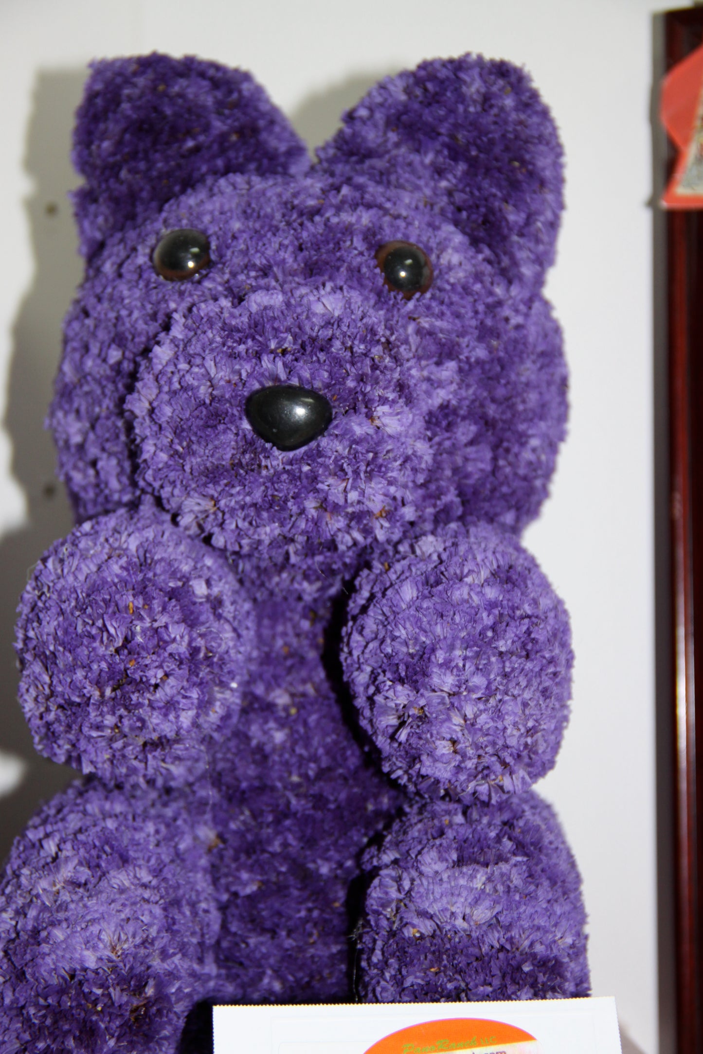 Preserved flower arrangement, teddy bear