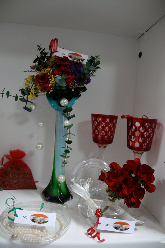 Forever rose with banquet in a decorative clear vase, with two wine cups